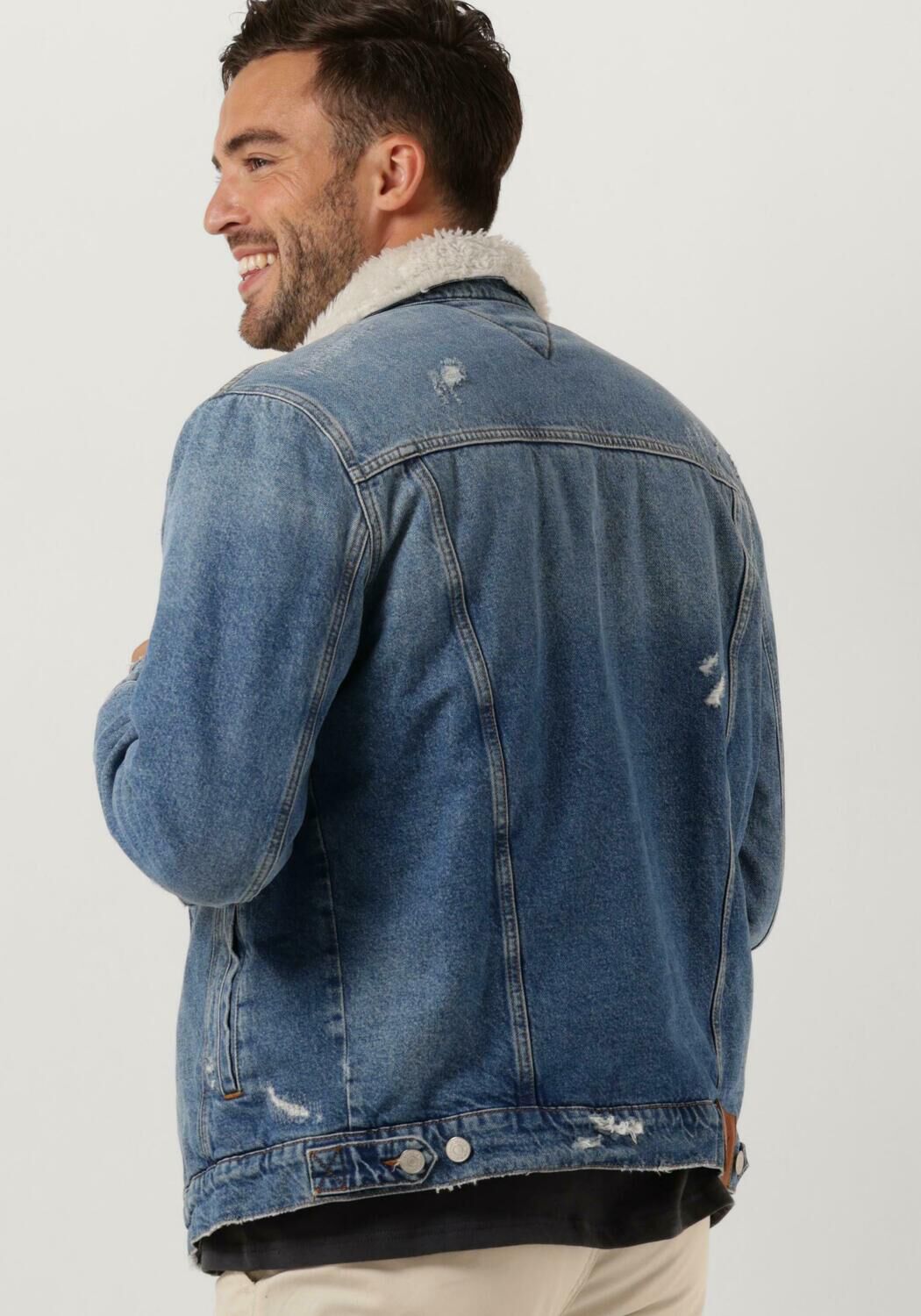 blauwe tommy jeans spijkerjas teddy trucker jacket