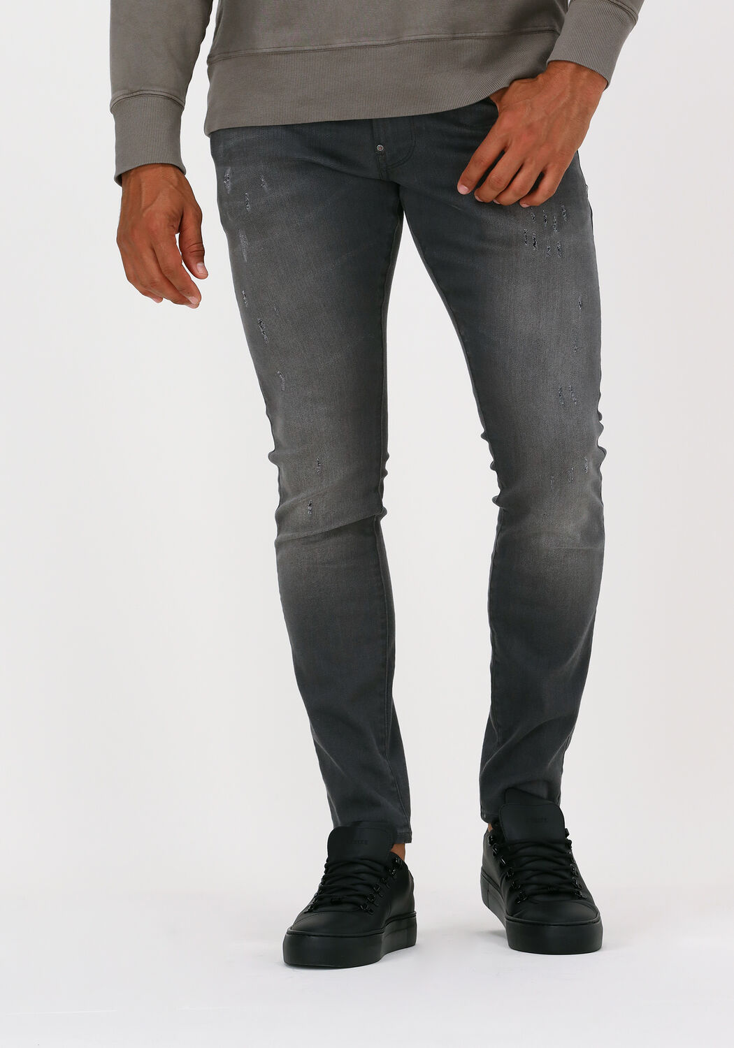 Grijze Heren Jeans met Scheuren en Zwarte Verfspatten - Black-Leo.nl