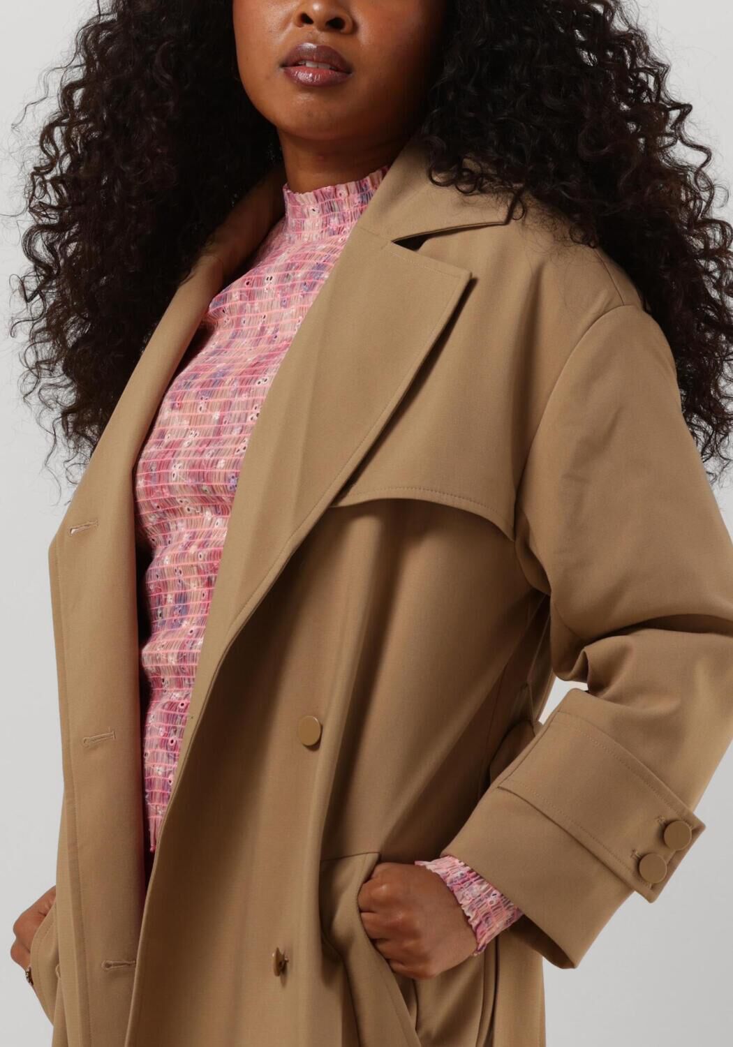 Second female deals trench coat