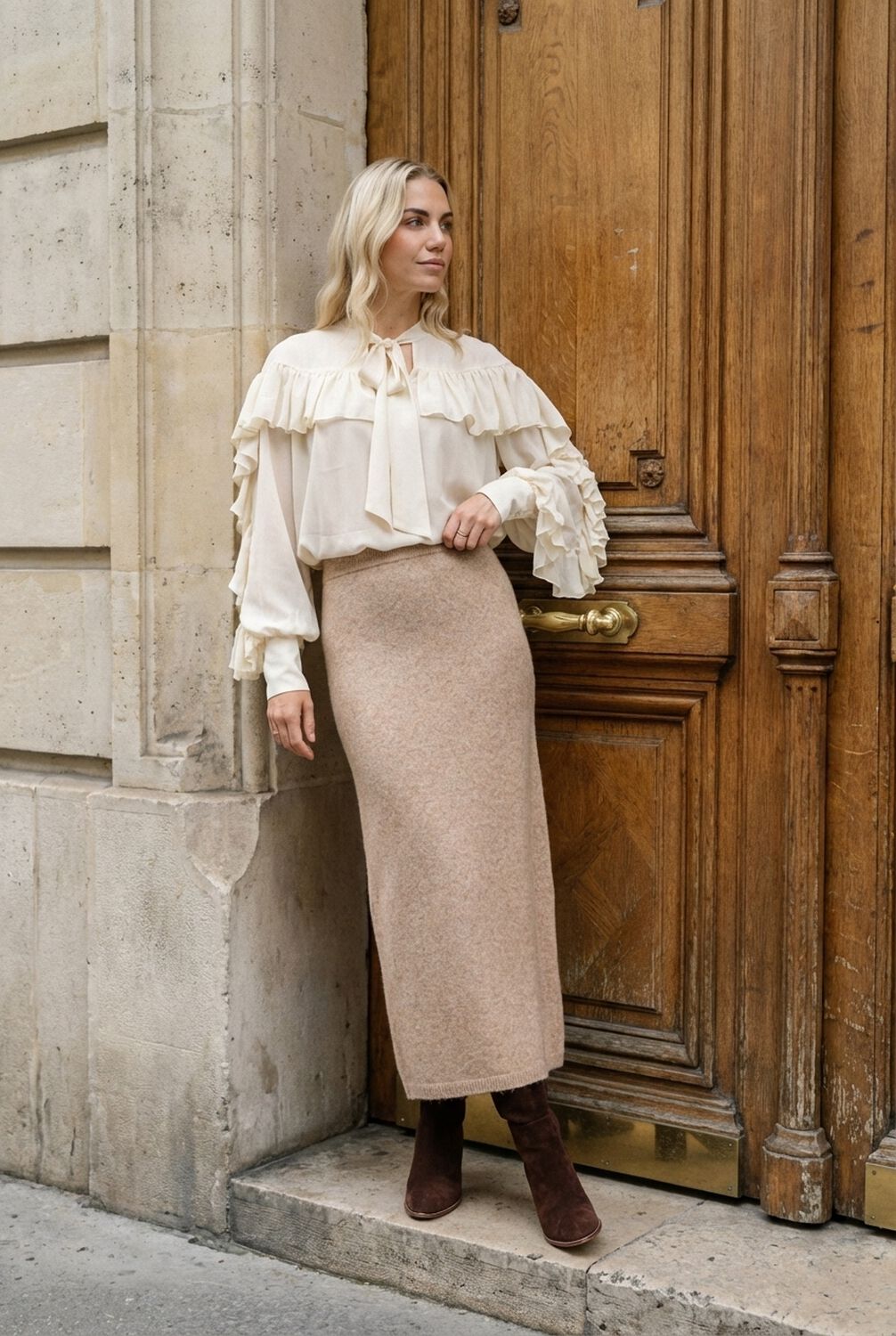 Cream blouse with knit midi skirt and knee high boots